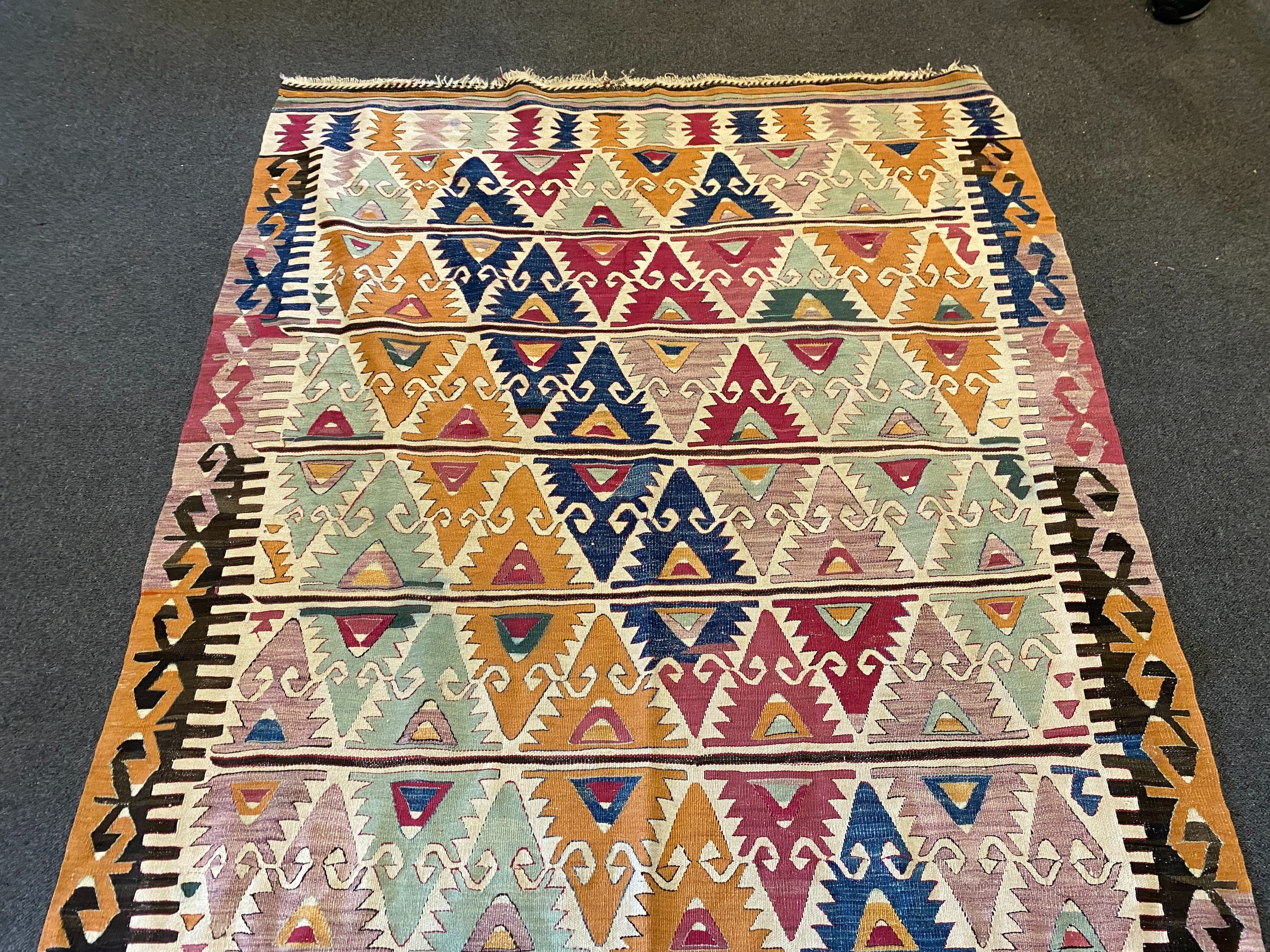 An Anatolian Kilim flatweave polychrome hall carpet, 410 x 156cm